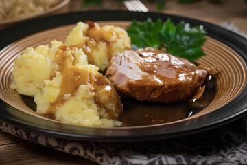 Braised pork neck in own sauce. Shallow depth of field.