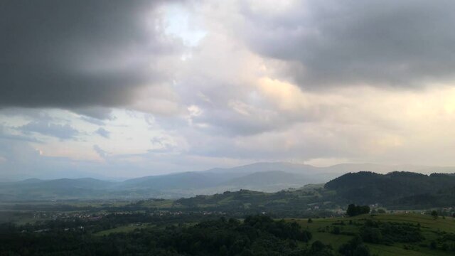 Aerial time lapse shot of Babia Gora in Beskidy at stormy weather.