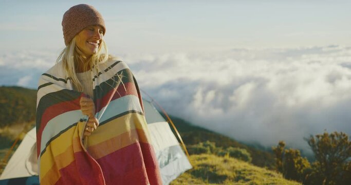 Beauitful young woman laughing and smiling, camping outdoors, adventure lifestyle
