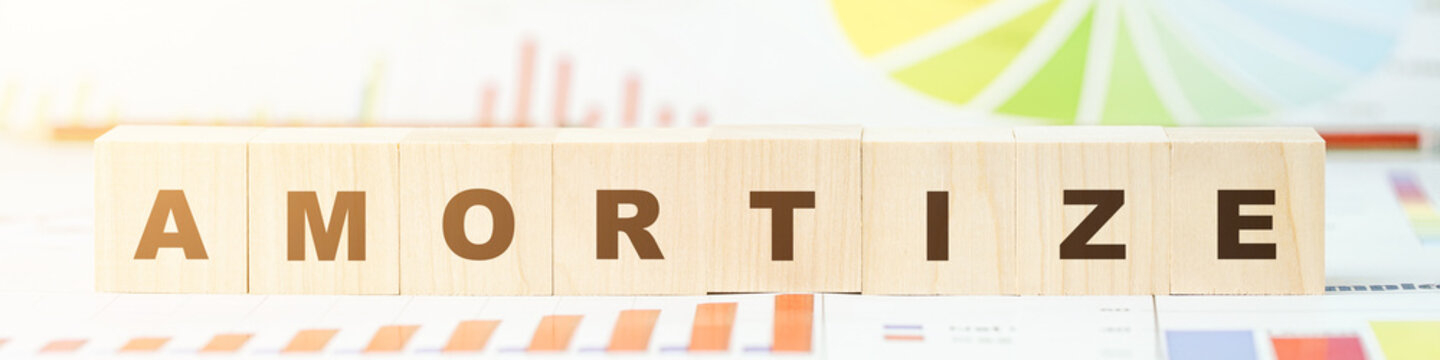word amortize made with letters on wooden blocks on desk