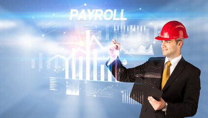 Handsome businessman with helmet drawing PAYROLL inscription, architecture business plan concept