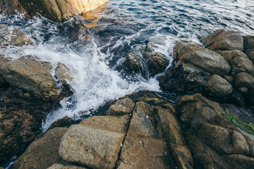 A large waterfall over a rocky cliff