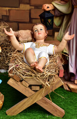 Statuettes of baby Jesus,The birthday of Jesus is a statuette of Maria with Joseph and newborn Jesus on the hay, A Christmas nativity scene. © masterjew
