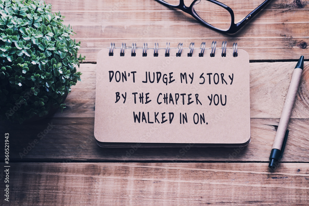 Wall mural inspirational and motivational quotes on a notepad - don't judge my story by the chapter you walked 