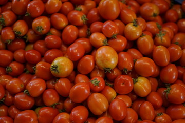 Fresh Red tomatoes for sale at traditional vegetables market