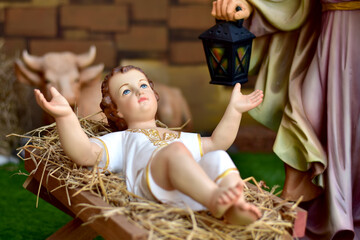 Statuettes of baby Jesus,The birthday of Jesus is a statuette of Maria with Joseph and newborn Jesus on the hay, A Christmas nativity scene. © masterjew