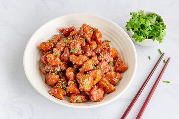Indian Style Spicy Chili Chicken on White Background with Cilantro, Onios and Chive