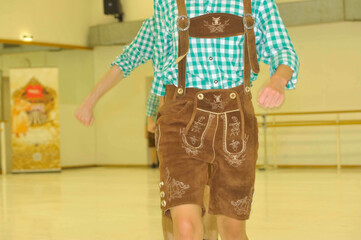 women in traditional leather trousers