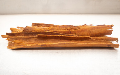 Pieces of Cinnamon (Cinnamomum verum) on a White Table in Medellin, Antioquia / Colombia