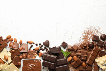 Chocolate, melted chocolate, coffee and almond on white background