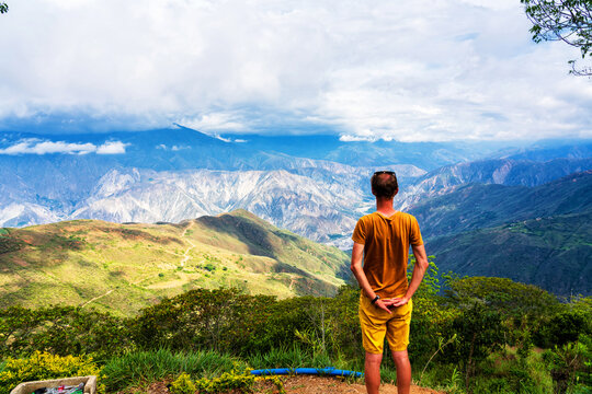 Man admiring views of Chicamocha canyon in Colombia in the Andes mountain range. South America