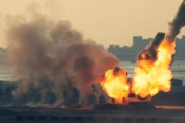 Close up of a Military strike or bomb in war on an SUV with tanks causing fire balls and explosion...