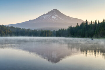 Mt Hood reflected in a lake with mist