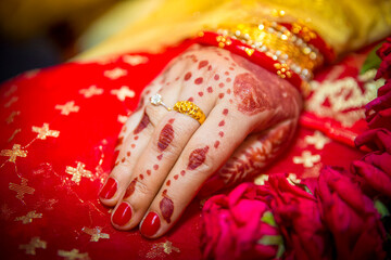 A bride's hand full of gold ornaments. Indian Wedding.