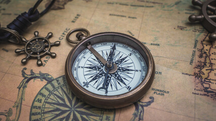 Fototapeta na wymiar Antique Nautical Compass On Map