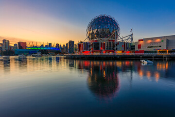 Fototapeta premium Iconic Science World at sunset blue hour with reflections in the water in Vancouver Canada