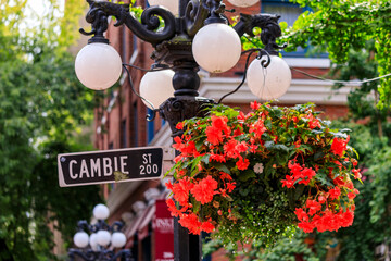 Cambie Street light and sign with flower basket in  Gastown district of Vancouver in British...