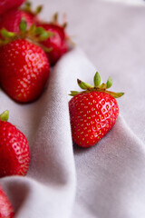 strawberries in a bowl on a white background
