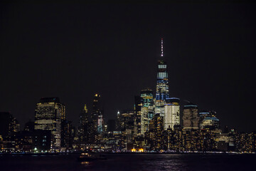 Fototapeta na wymiar Winter cruise . New York City skyline by night. View from Hudson river, New York, USA, America. 