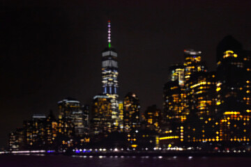 Fototapeta na wymiar New York City skyline by night. View from Hudson river. Motion blur creative image.