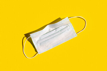 Medical or surgical face inside on a bright yellow background.