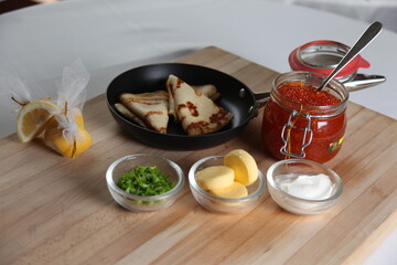 Blinis with red caviar