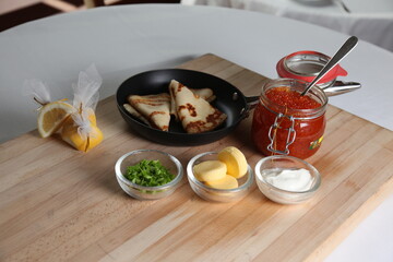 Blinis with red caviar
