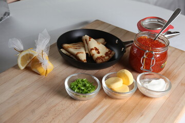 Blinis with red caviar
