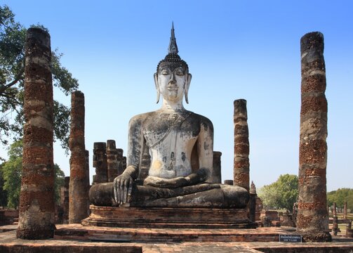 Statue of Buddha in Sukothai Historical Park. Ancient city Sukothai is now famous tourist destination in Thailand.