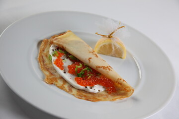Blinis with red caviar