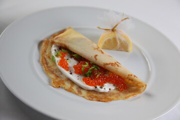 Blinis with red caviar