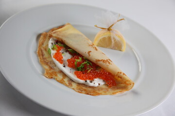 Blinis with red caviar
