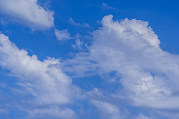 Naklejka na ściany i meble Blue sky with clouds. Natural fresh background. High quality photo
