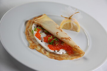 Blinis with red caviar
