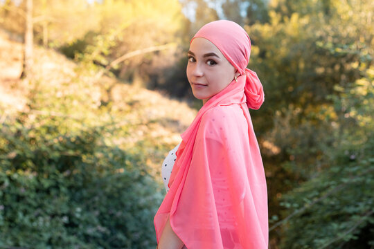 Woman With Cancer Wearing A Pink Scarf Looking Fighter