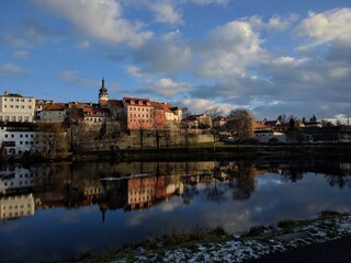 Fototapeta na wymiar view of the old pisek town over the river with reflection and clouds during sunny day