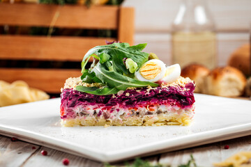 Russian dish Herring under a fur coat with greens 