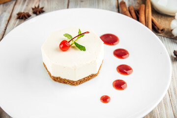 Gourmet dessert red berry cheesecake with mint