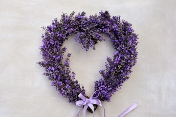 Lavender heart wreath on white background close-up