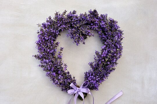 Lavender heart wreath on white background close-up