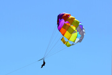 Paragliding in the blue sky