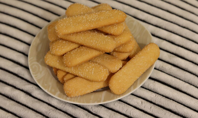 Delicious crispy biscuit coated with sugar crystals.