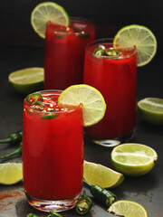 Jalapeno tomato margarita cocktail with lime