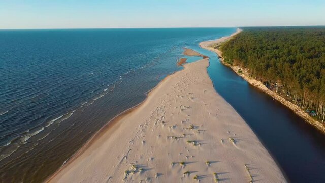 Irbe River Meets Baltic Sea Aerial Dron Shoot. The River in Latvia of Irbe Flows Into the Baltic Sea.