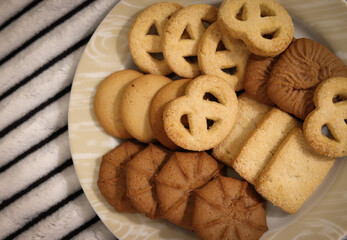 Several buttery biscuits on the plate.