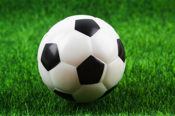 Fototapeta na wymiar Traditional soccer ball on soccer field. Football ball on green grass stadium football field, game, sport. Background for design.