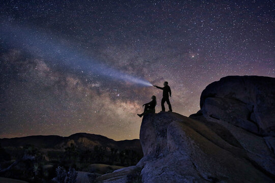 Loving Couple Silhouette Under the Stars at Night