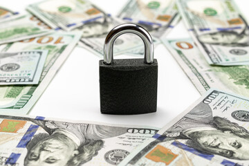 Money security. One hundred dollars of America with lock isolated on white. Usd cash money...