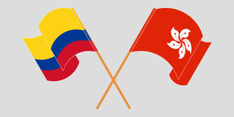 Crossed and waving flags of Colombia and Hong Kong