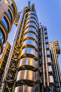 View of Lloyd buildings at sunset - home of insurance institution Lloyd of London, like Pompidou Centre in Paris (designed by Rogers, 1986). London, England. June 22, 2018.